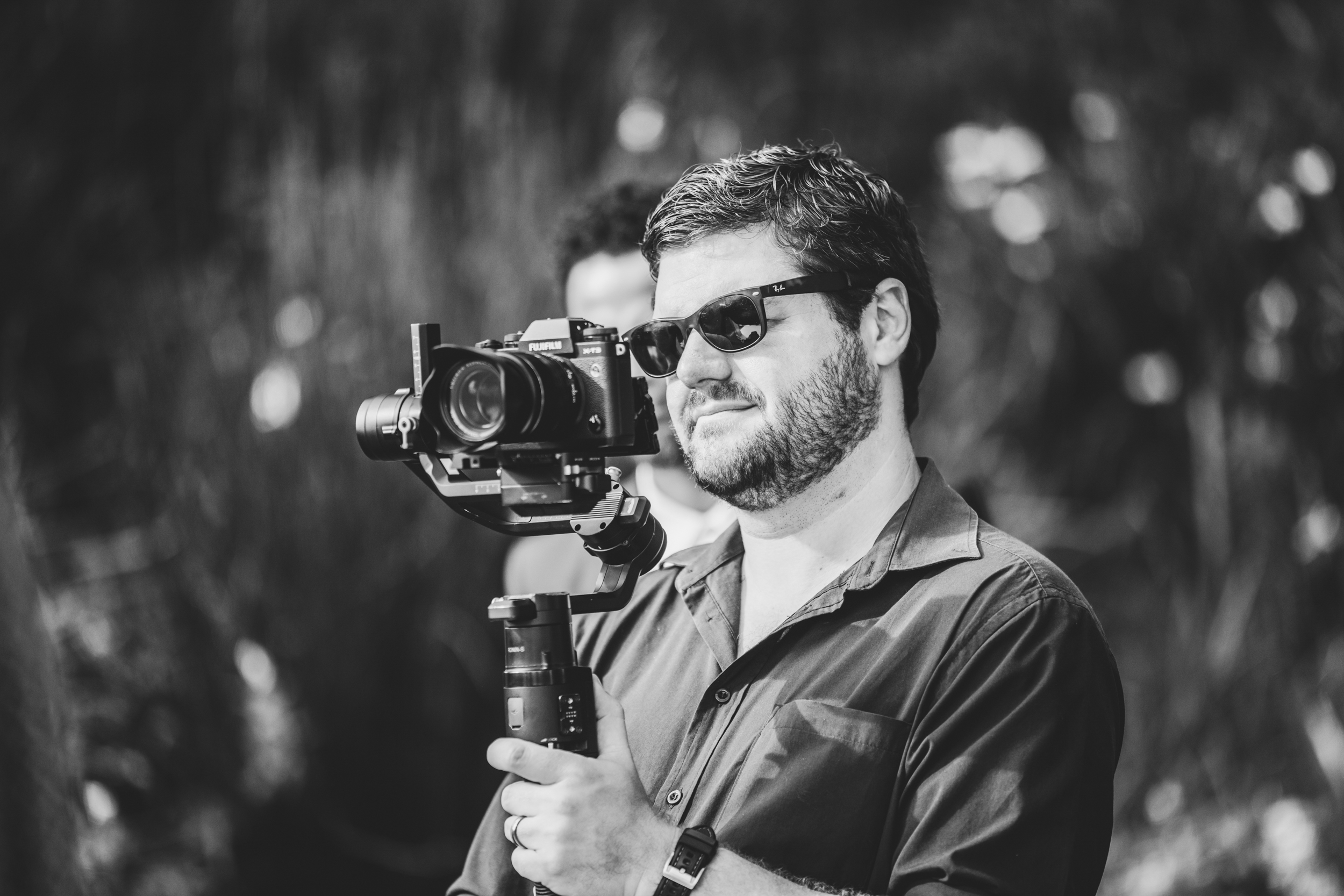 An Eighty One Moments team member behind the camera on location